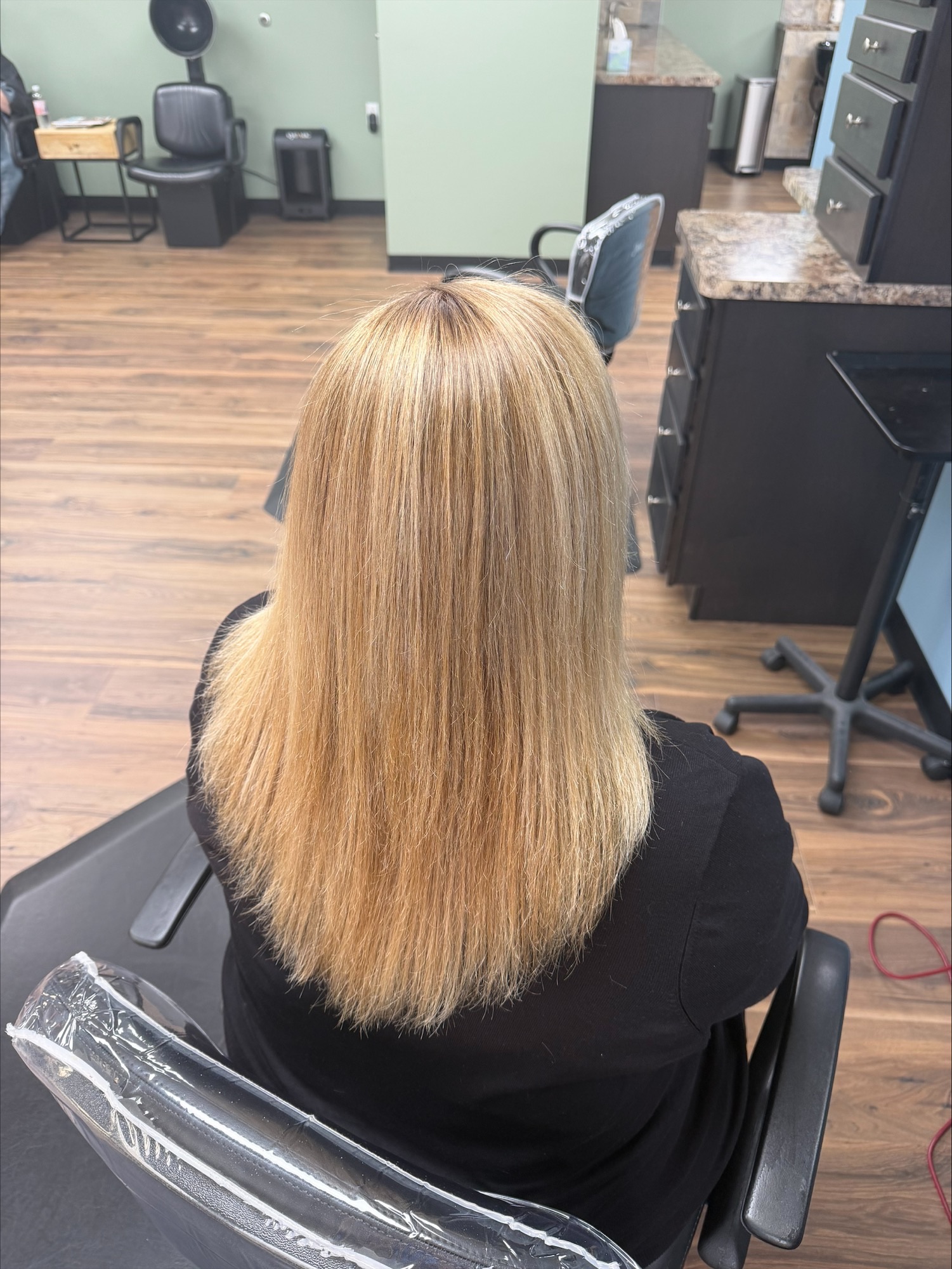 Long blonde haircut at Favero's Hair Salon