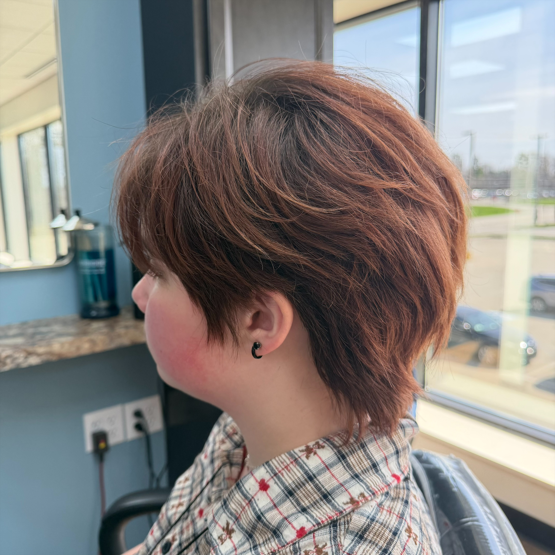 Short layered brunette haircut at Favero's Hair Salon