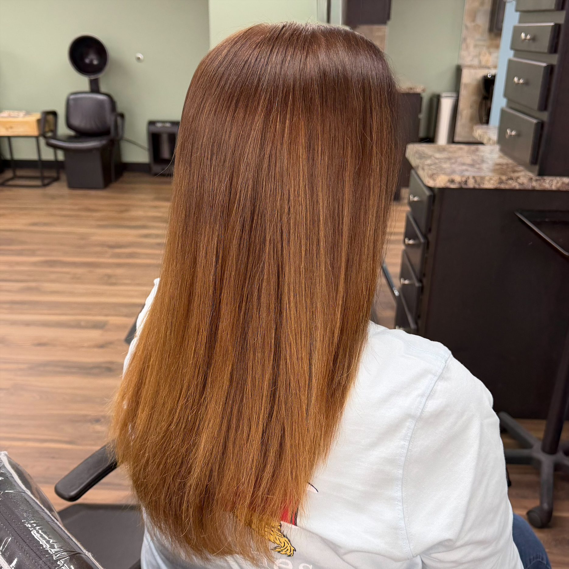 Long copper dimensional color at Favero's Hair Salon