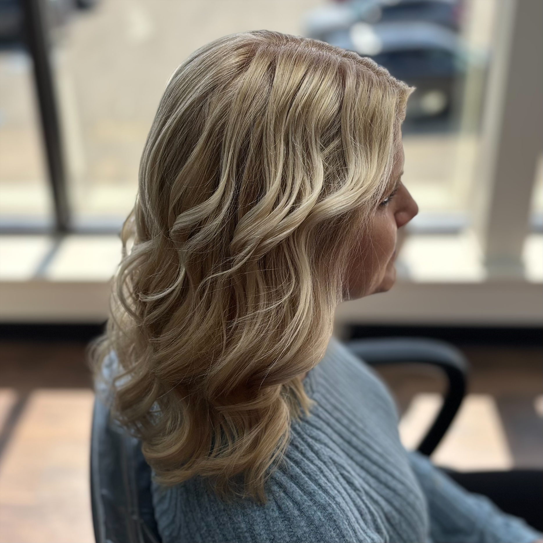 Blonde curled hairstyle at Favero's Hair Salon