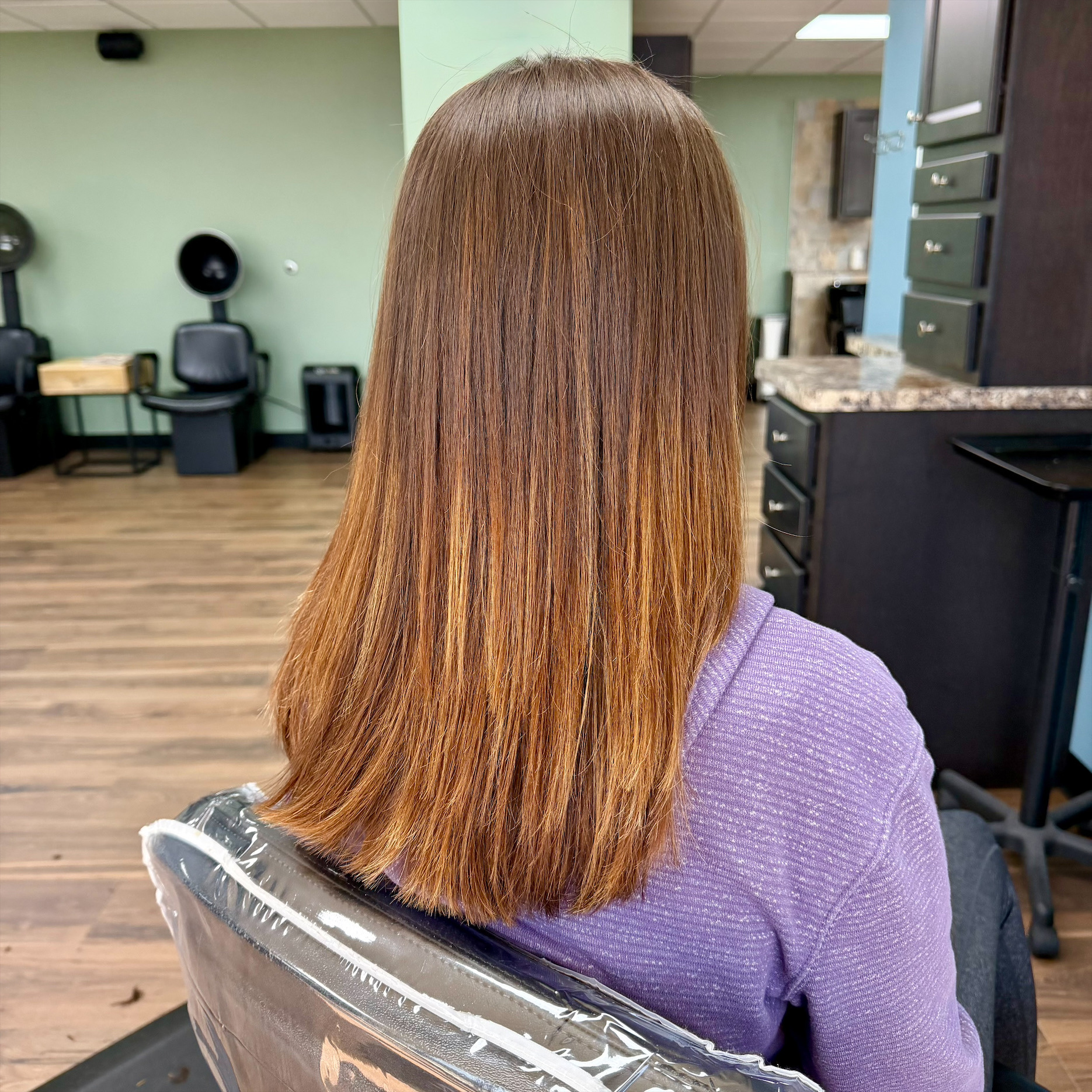 Long warm dimensional hair color at Favero's Hair Salon
