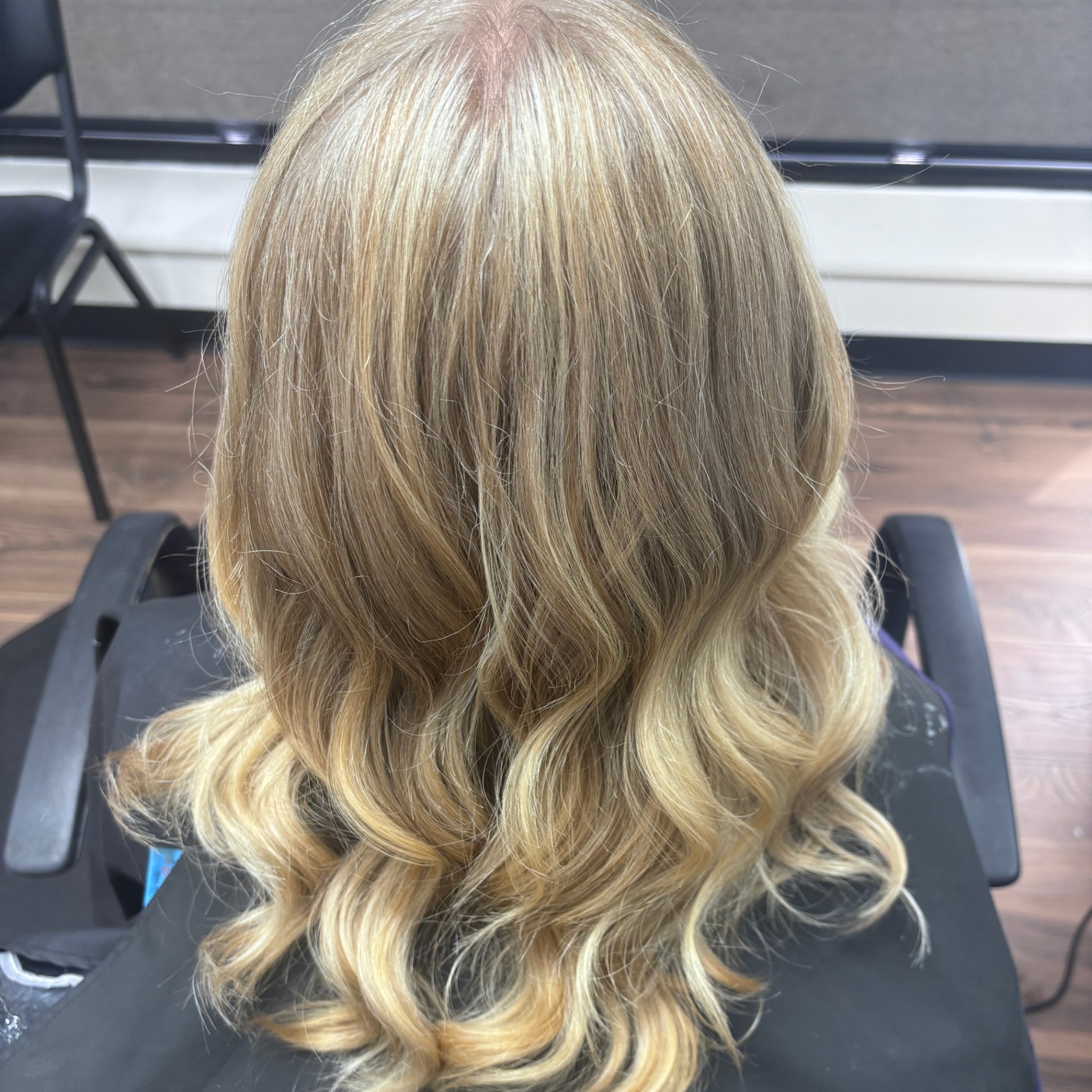 Blonde highlights with curled ends at Favero's Hair Salon