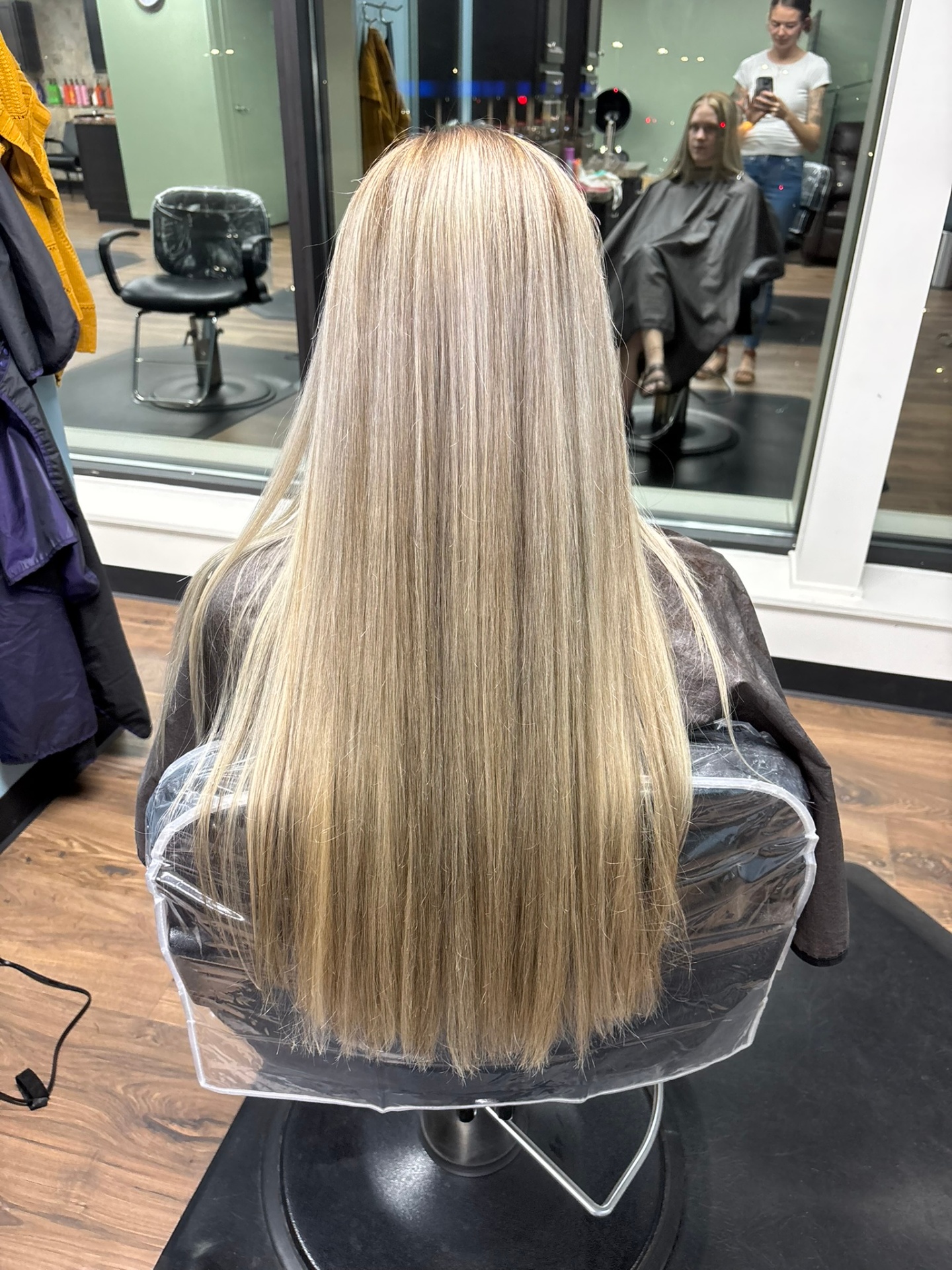 Long straight blonde balayage at Favero's Hair Salon