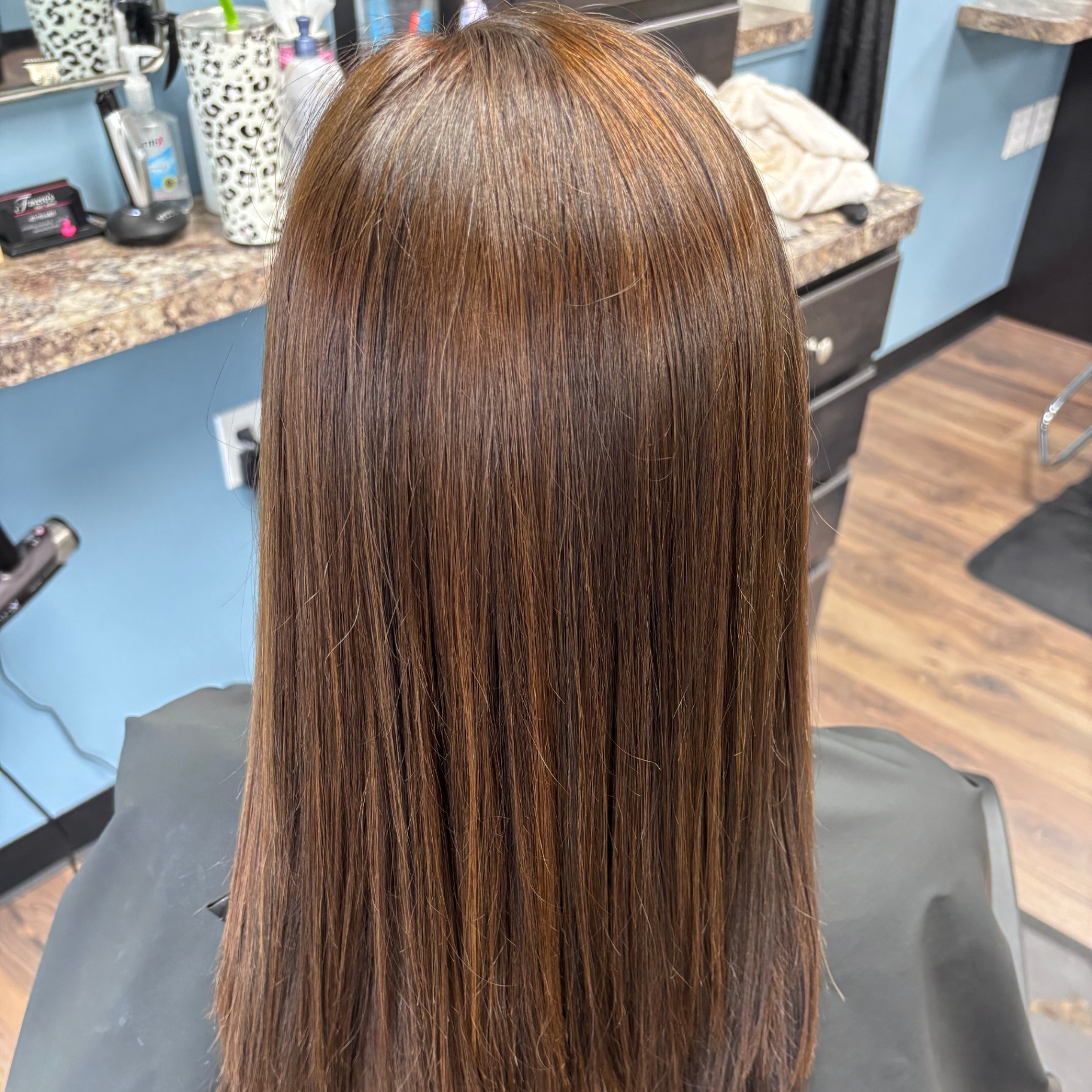 Long glossy brunette color at Favero's Hair Salon