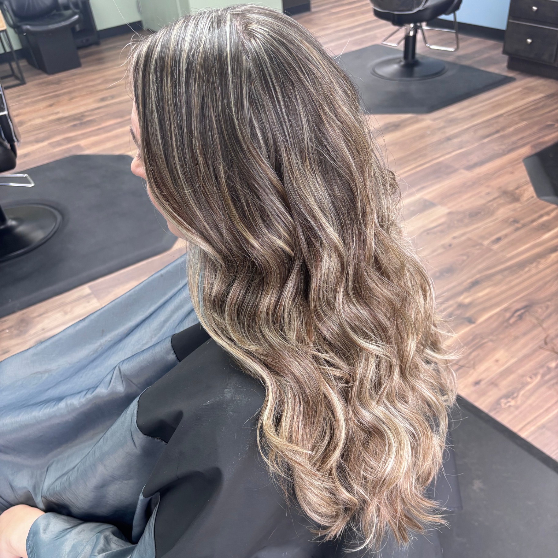Cool toned lived-in blonde waves at Favero's Hair Salon