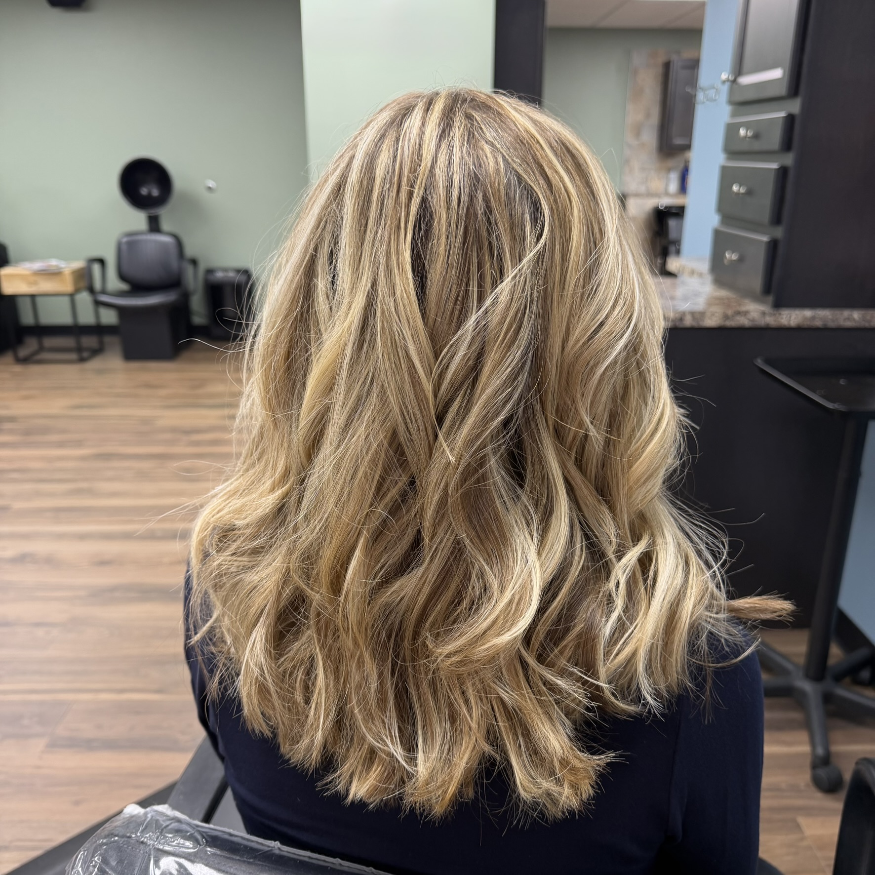 Bright blonde balayage waves at Favero's Hair Salon