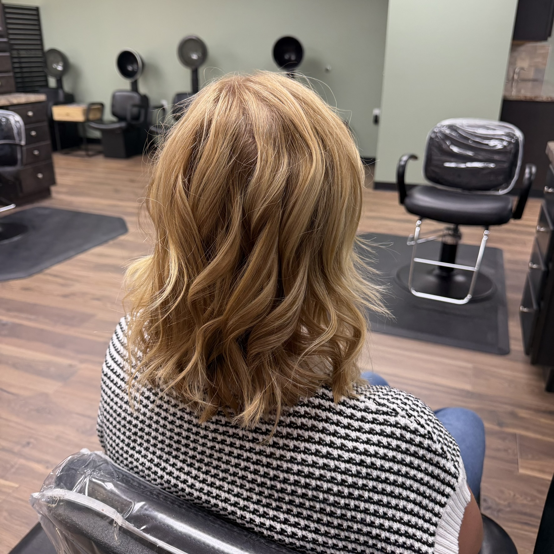 Honey blonde wavy lob at Favero's Hair Salon
