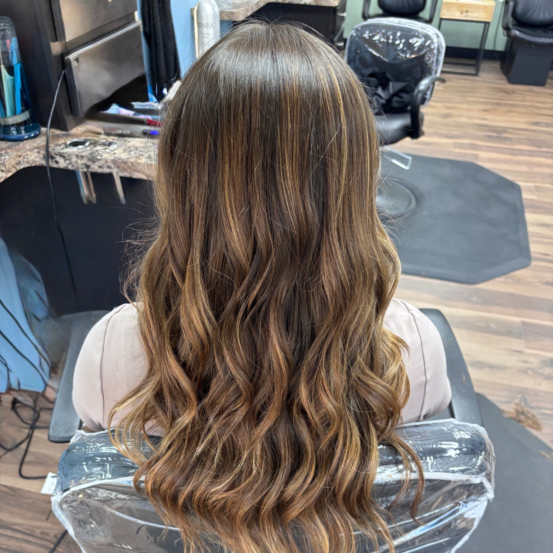 Long brunette balayage waves at Favero's Hair Salon